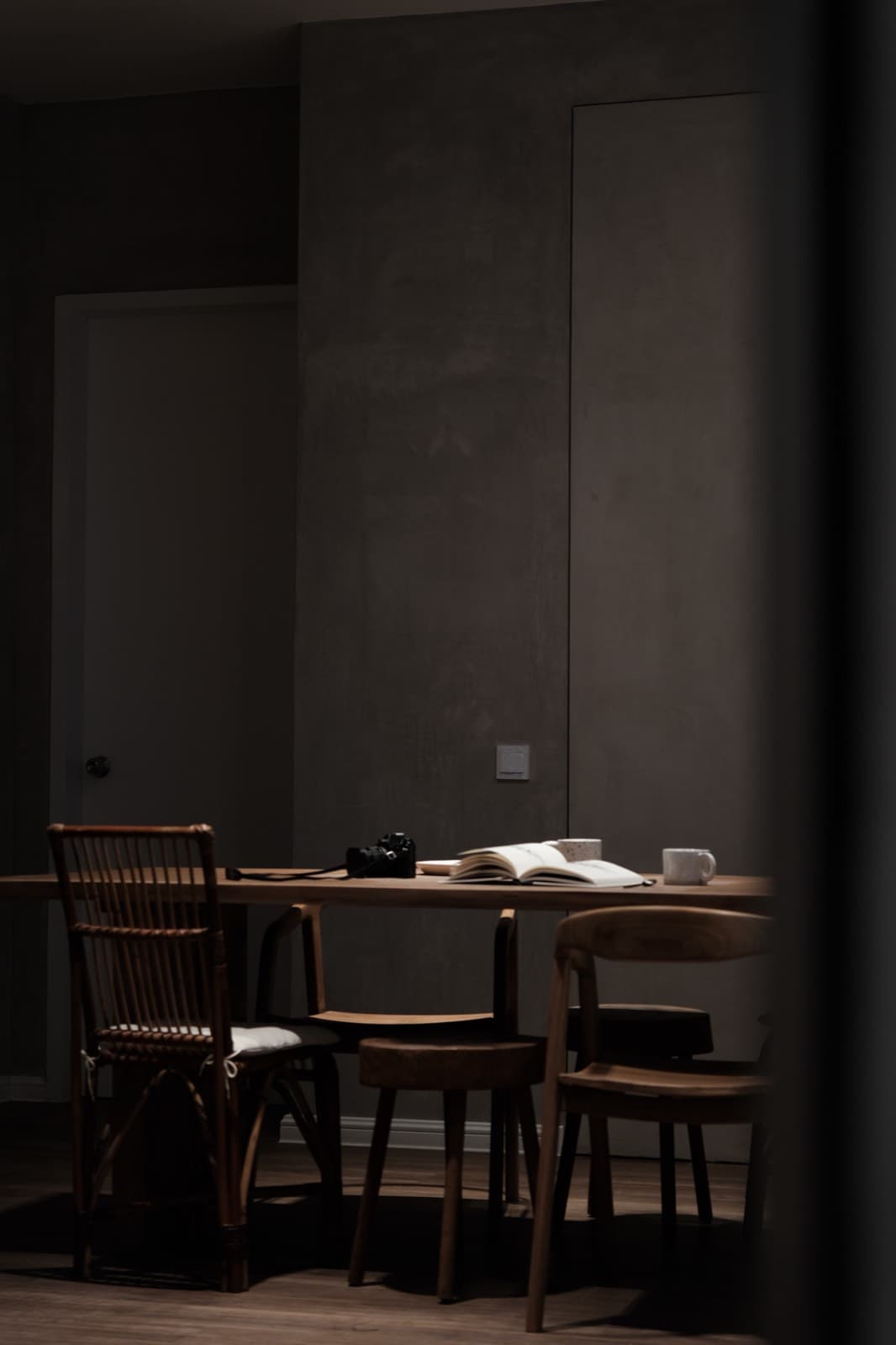 Moody dining nook with timber chairs